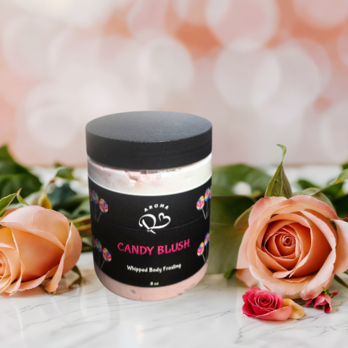 Jar of 'Candy Blush' whipped body food with roses on a marble surface